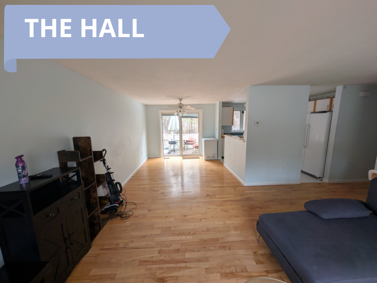 Bright and spacious living room at Maple House with comfortable seating.