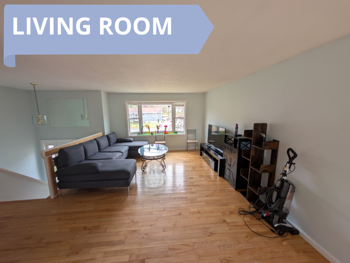 A cozy, well-lit private bedroom with a large window.